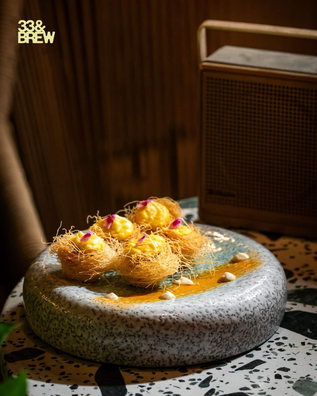 Kataifi nests dessert served on speckled ceramic at 33&BREW